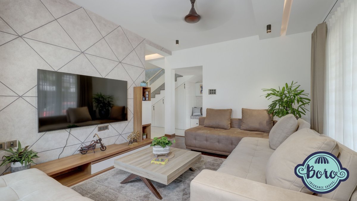 Furnished apartment living room representing renters insurance in Pennsylvania, with The Boro Insurance Shoppe logo
